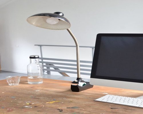 organized work desk with water and natural light